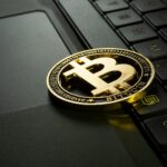 BTC coin on laptop keyboard - Jievani Weerasinghe / Unsplash