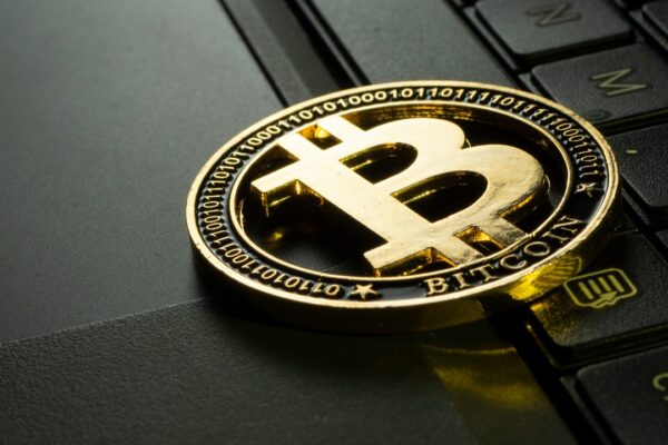 BTC coin on laptop keyboard - Jievani Weerasinghe / Unsplash