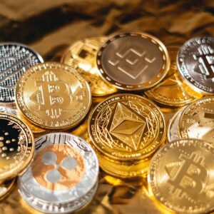 Pile of golden BTC coins - Art Rachen / Unsplash