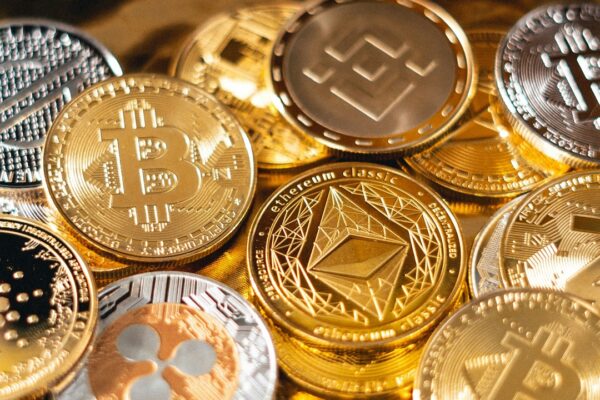 Pile of golden BTC coins - Art Rachen / Unsplash