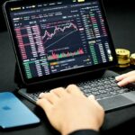 BTC coin on red/green chart - Kanchanara / Unsplash